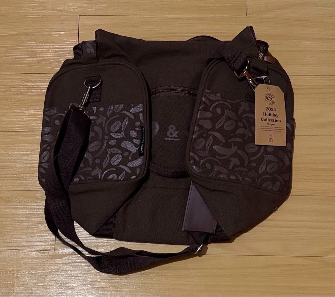 The Coffee Bean & Tea Leaf Affogato Duffel Bag (Category: Travel Essentials & Accessories) located in Quezon City. Submitted by garagesale2026 (Listing ID 1468079895, Image 2). Description: - Brand new - 2024 Holiday Collection - Side pockets; Interior zippered pocket; Adjustable shoulder strap.