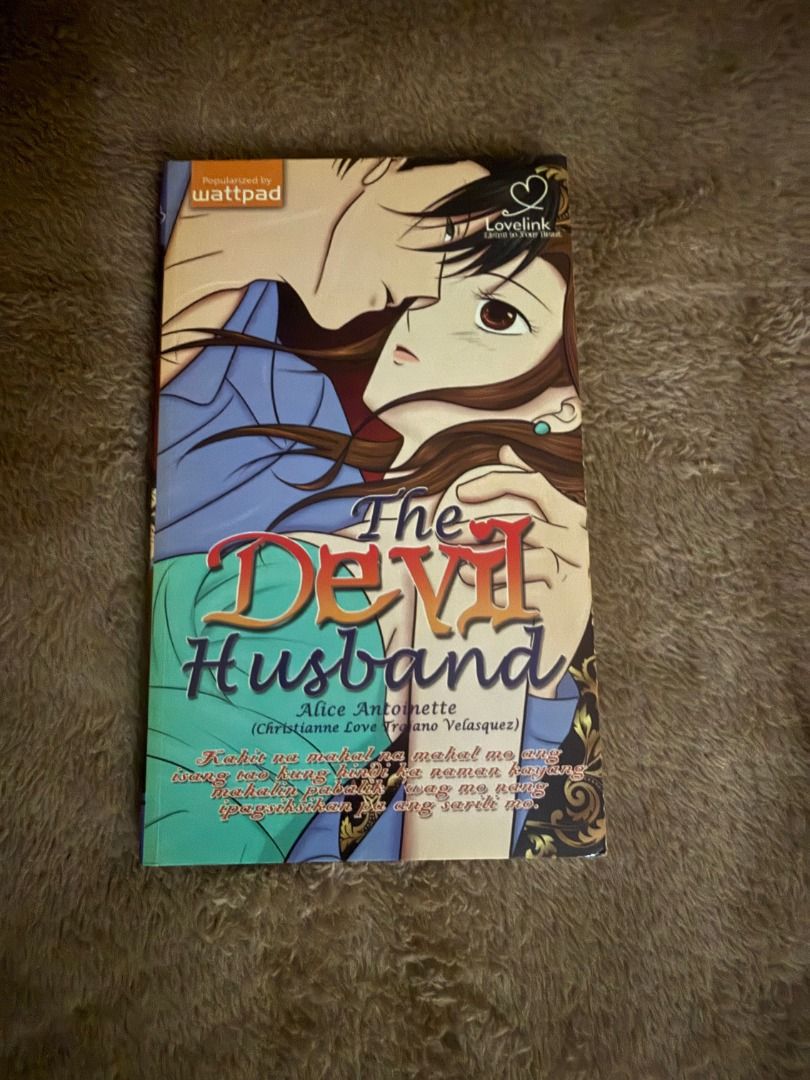 The Devil Husband by Alice Antoinette (Category: Storybooks) located in Manila. Submitted by bellevuebooks (Listing ID 1468267604, Image 1). Description: Popular Wattpad book titled The Devil Husband. Written by Alice Antoinette. Lovelink edition. Anime style couple illustration on the front cover. Tagalog romance fiction novel. Clean copy, crisp pages. Great addition to your local YA romance collection..