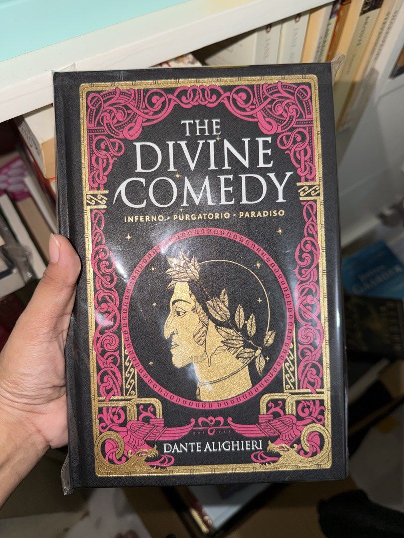 The Divine Comedy| Dante Alighieri (Category: Storybooks) located in Silang. Submitted by papieriiibookstogo (Listing ID 1468275990, Image 1). Description: Preloved Classic Epic Poem | Dante Alighieri The Divine Comedy: ₱ 500 Genre: Classic poetry and epic literature Dante’s journey through Hell, Purgatory, and Heaven, in a hardbound edition with a black, pink, and gold cover. Perfect for classics lovers and dark academia shelves. 🖤 Condition: b
