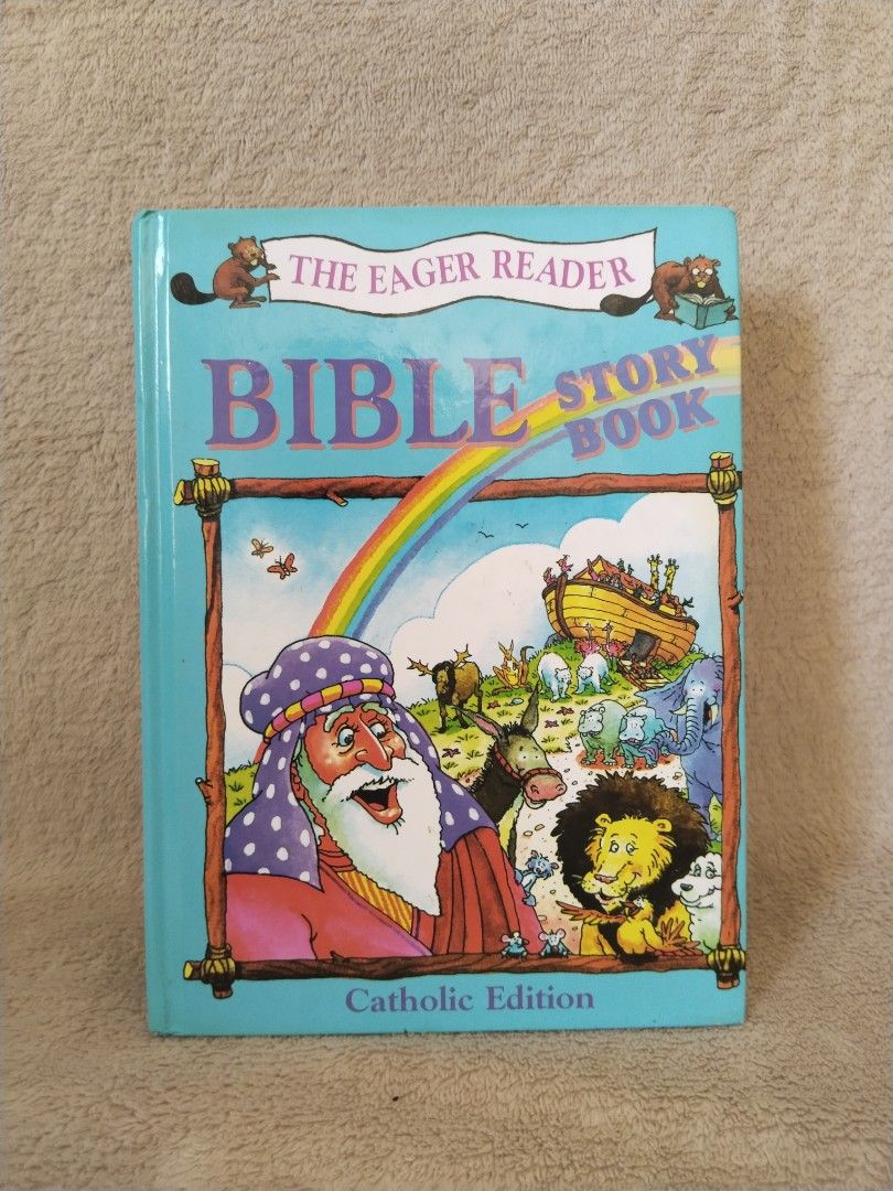 The Eager Reader Bible Story Book Catholic Edition (Category: Religion Books) located in Cavite. Submitted by munting_aklatan_ph (Listing ID 1468109485, Image 2). Description: - Illustrated Catholic Bible story book for kids, 427 pages - Covers both Old and New Testament stories (Joseph, Moses, Jesus, and more) - Colorful cartoon pictures on every page - Includes reading comprehension questions at the end of each story - Hardcover format with cle