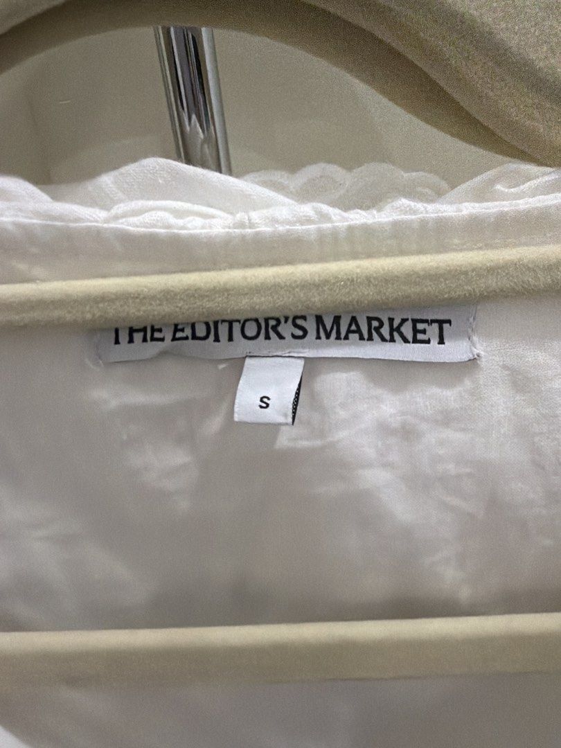The Editor's Market White Ruffle Blouse (Category: Blouses) located in Tuguegarao City. Submitted by alyssa.closet96 (Listing ID 1468077391, Image 3). Description: - Brand: The Editor's Market - Size: S - Design: Subtle vertical stripes and pleated side panels - used once - Condition: Excellent - RFS: gained weight, do not fit anymore.
