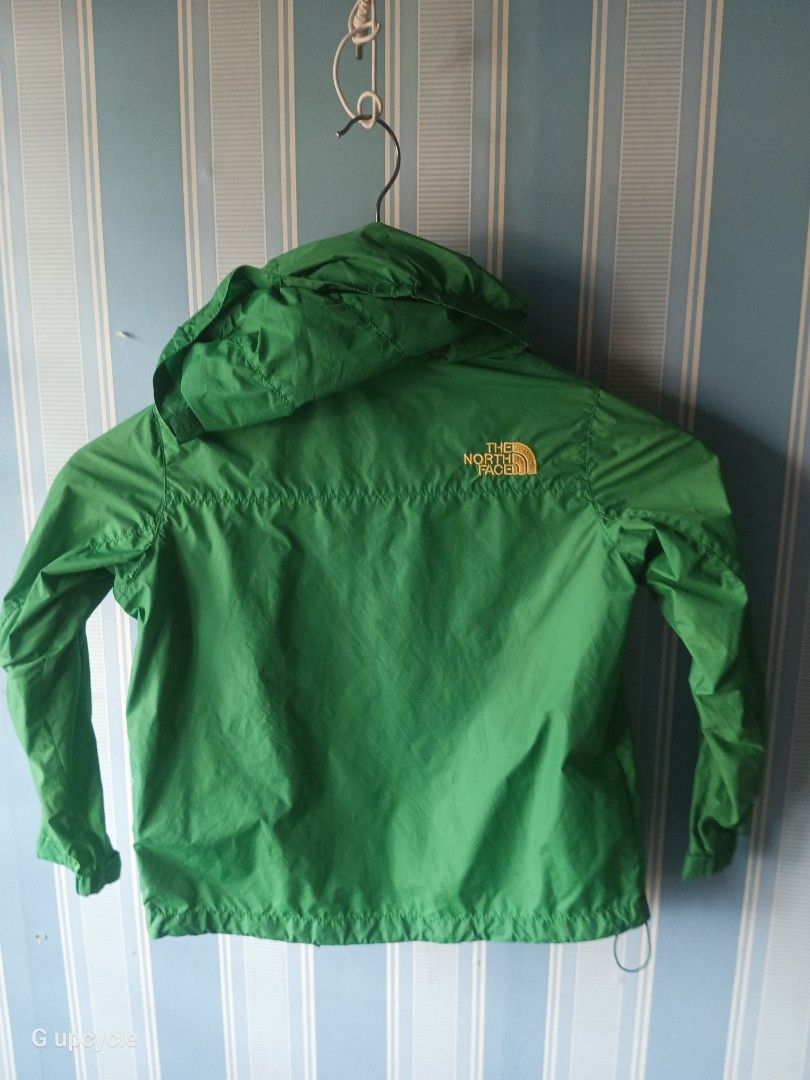 THE NORTH FACE KIDS JACKET. (Category: Hiking & Camping) located in Cebu City. Submitted by glennbryceland031185 (Listing ID 1468083631, Image 3). Description: The North Face children's nylon windbreaker jacket with a yellow chest pocket, blue zippers, and an embroidered logo on the upper right chest..