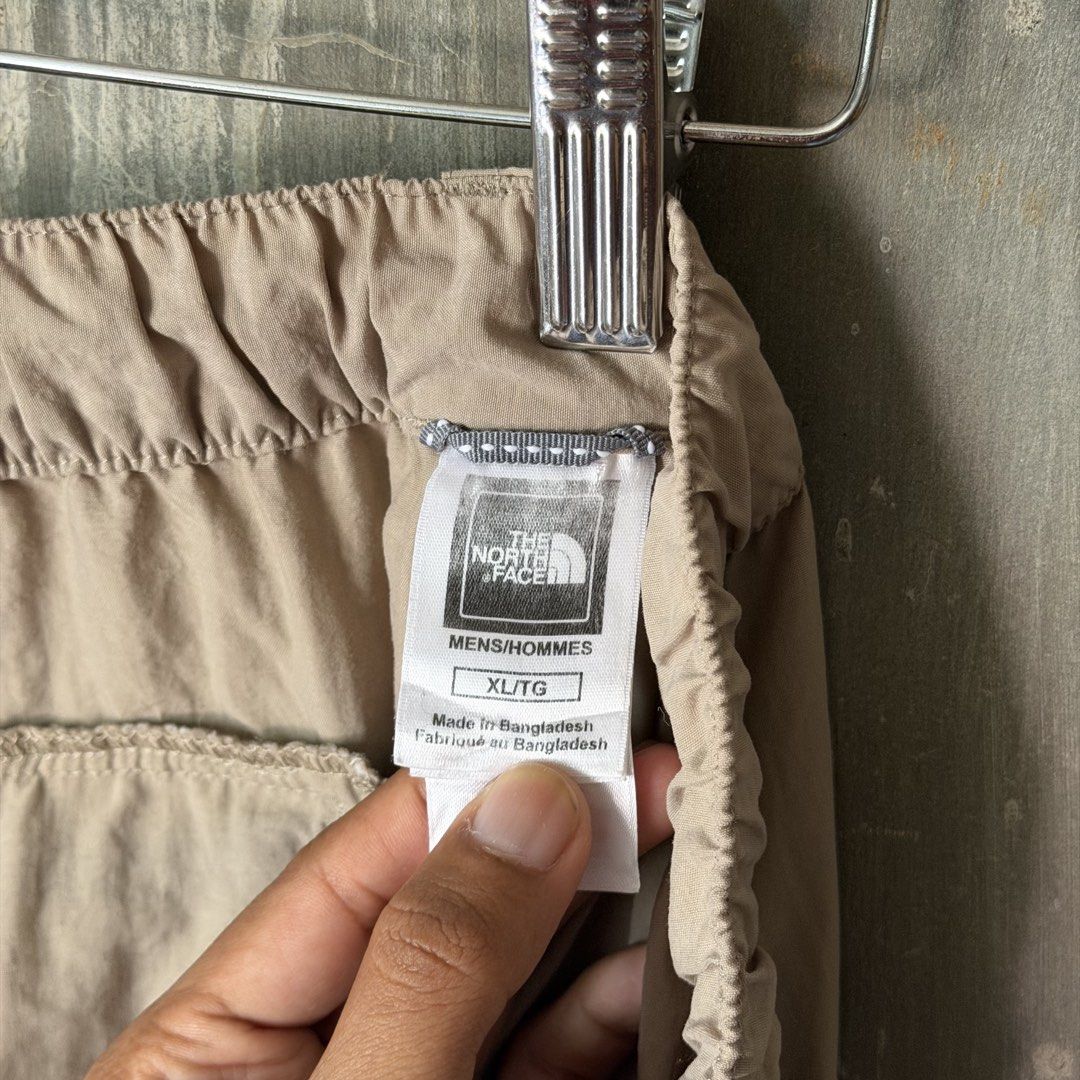 The North Face Utility Nylon Cargo Shorts (Category: Shorts) located in Puerto Princesa. Submitted by terdsthrift (Listing ID 1468251727, Image 3). Description: The North Face Utility Nylon Cargo Shorts Size: XL Waist: 38-40 Length: 22.5 Hem: 13.5 In Good Condition / Small Bluish Mark Unoticeable Color Rate: 10/10 - Brand: The North Face - Color: Khaki - Size: XL - Material: Lightweight nylon - Features: Elastic waistband, button closure, multipl