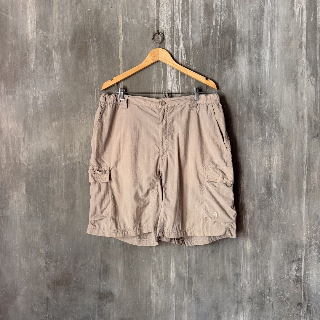 The North Face Utility Nylon Cargo Shorts (Category: Shorts) located in Puerto Princesa. Submitted by terdsthrift (Listing ID 1468251727, Image 1). Description: The North Face Utility Nylon Cargo Shorts Size: XL Waist: 38-40 Length: 22.5 Hem: 13.5 In Good Condition / Small Bluish Mark Unoticeable Color Rate: 10/10 - Brand: The North Face - Color: Khaki - Size: XL - Material: Lightweight nylon - Features: Elastic waistband, button closure, multipl