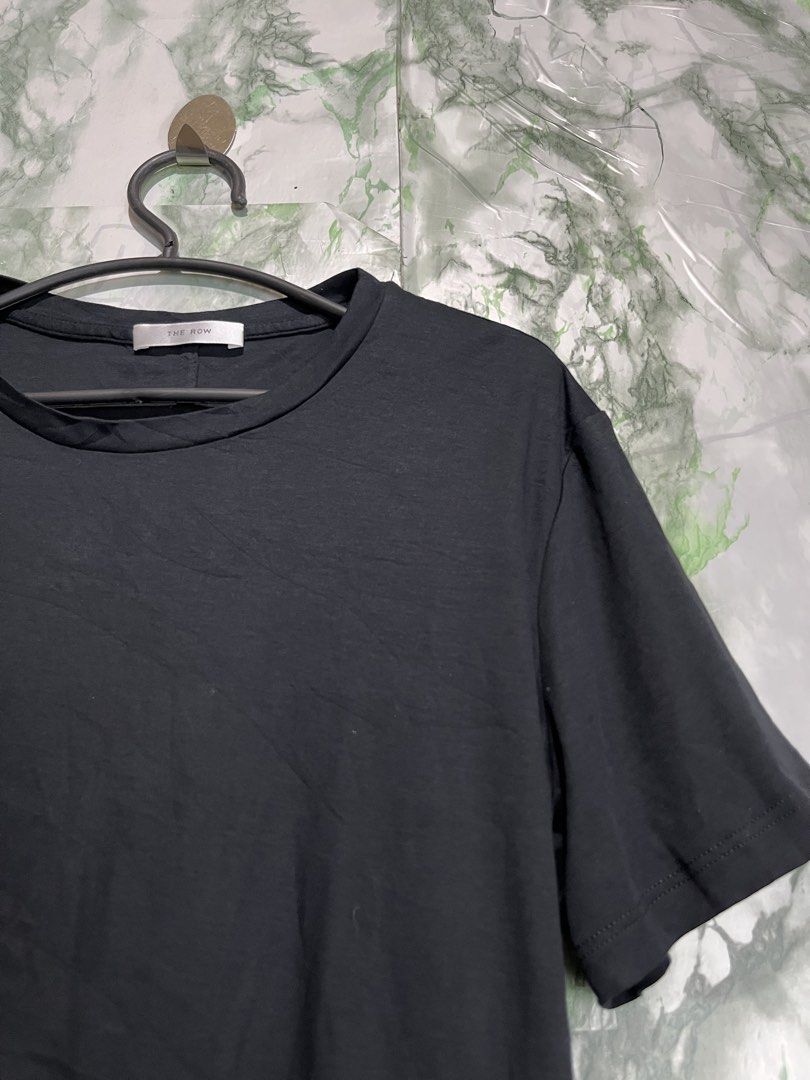 THE ROW T-shirt (Category: Shirts) located in Bulacan. Submitted by letsfindukaywithme (Listing ID 1468064490, Image 3). Description: The Row T-shirt XL 19x24" Cotton strechable like new No issue +sf payment first Ship via J&T.