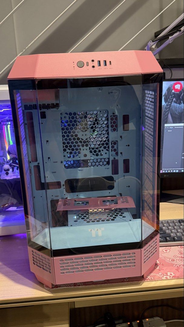 Thermaltake Pink Computer Case (Category: Desktops) located in Makati City. Submitted by jayzld (Listing ID 1468262247, Image 2). Description: - Brand: Thermaltake Tower PC Case - Color: Aesthetic Pastel Pink - Panels: Massive tempered glass on front and side for full component visibility - Features: Clean interior, PSU shroud with logo, honeycomb ventilation mesh - I/O Panel (Top): Dual USB 3.0, USB-C, audio jacks, and power buttons - Condition: