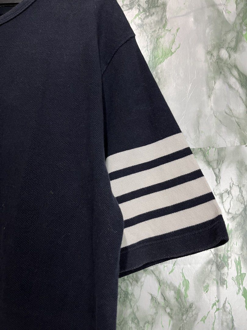 THOM BROWNE four-stripe shirt (Category: Formal Shirts) located in Bulacan. Submitted by letsfindukaywithme (Listing ID 1468063432, Image 3). Description: THOM BROWNE four-stripe sleeves shirt Size 3 20x27" Back sleeves: 29" Color: Navy Blue like new Minimal Issue on tag at the bottom but still presentable and readable +sf payment first Ship via J&T .