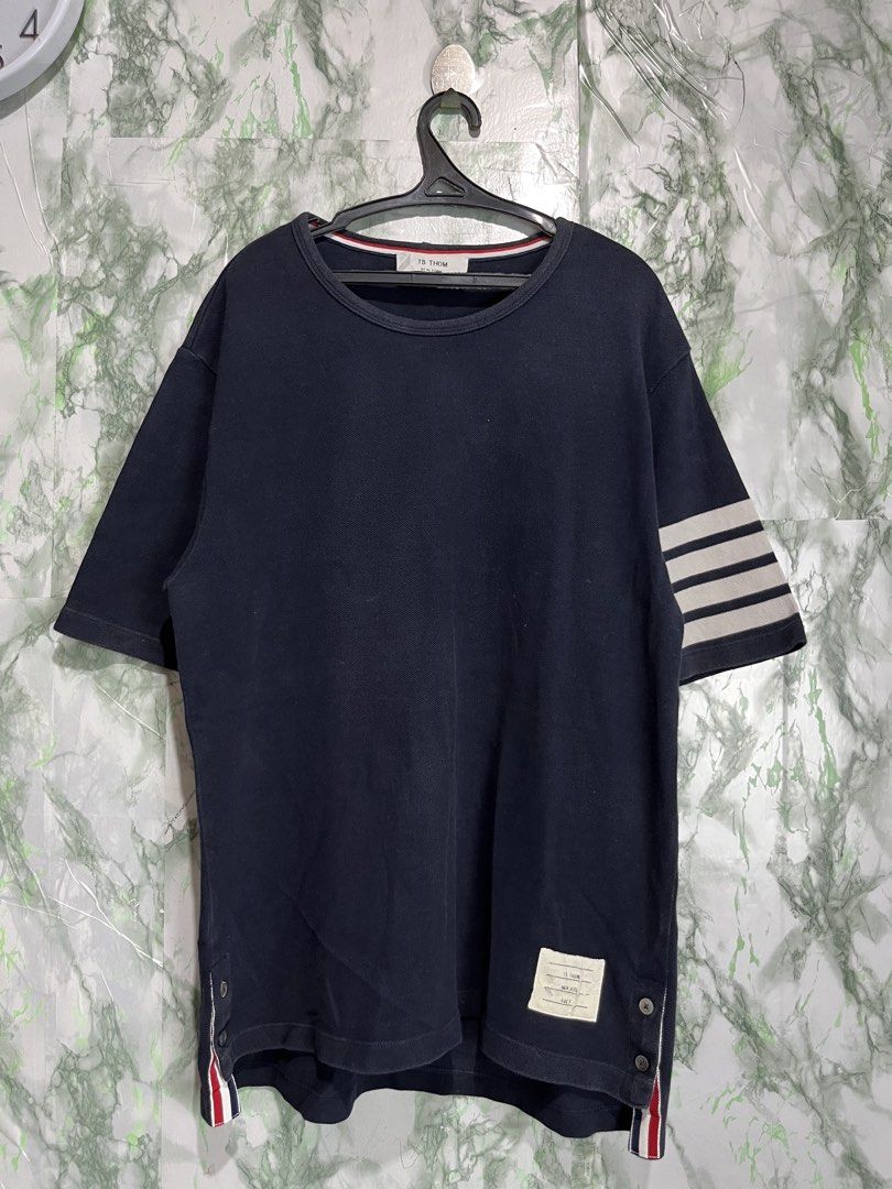 THOM BROWNE four-stripe shirt (Category: Formal Shirts) located in Bulacan. Submitted by letsfindukaywithme (Listing ID 1468063432, Image 2). Description: THOM BROWNE four-stripe sleeves shirt Size 3 20x27" Back sleeves: 29" Color: Navy Blue like new Minimal Issue on tag at the bottom but still presentable and readable +sf payment first Ship via J&T .