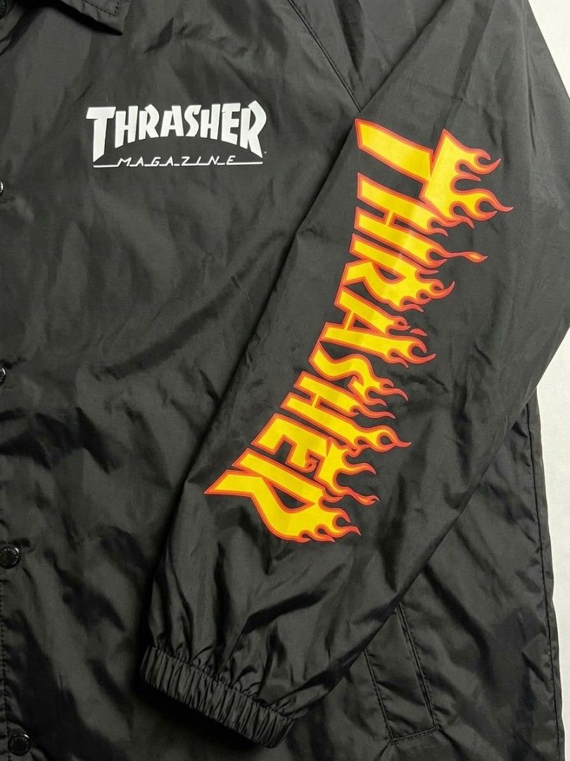 Thrasher Magazine Flame Sleeve Black Coach Jacket (Category: Coats, Jackets and Outerwear) located in Manila. Submitted by youngturtle.8e129a (Listing ID 1468280978, Image 2). Description: - Brand: Thrasher Magazine - Item: Coach Jacket - Color: Black - Size: Lager - Details: Flame logo on left sleeve, small Thrasher text on chest and right cuff - Features: Snap button closure, dual side pockets, drawstring hem - Style: Classic streetwear.