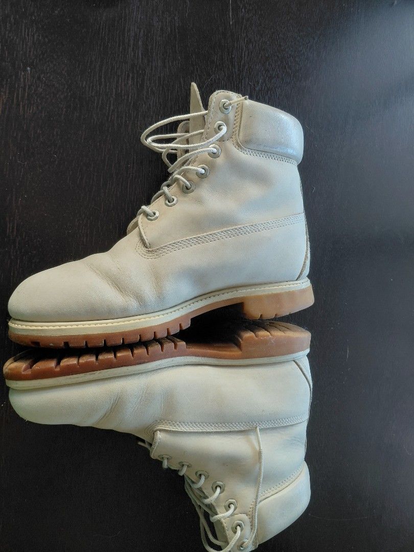 Timberland White Leather Boots (Category: Boots) located in Baguio. Submitted by undressme24 (Listing ID 1468068040, Image 3). Description: - Brand: Timberland - Material: Genuine white leather - Style: Lace-up with classic padded collar and chunky gum soles - Details: Iconic Timberland tree logo embossed on the side - Condition: Normal signs of wear on leather and soles, well-maintained and ready to wear - Perfect for: Streetwear, casual fits, a