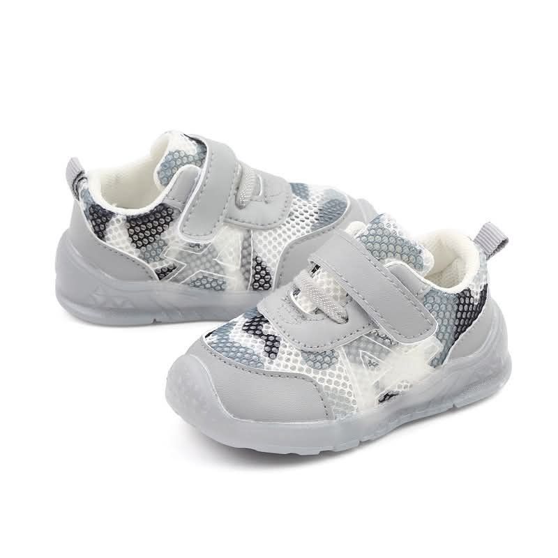 Toddler Soft Sole Walking Shoes (Category: Babies & Kids Fashion) located in Manila. Submitted by eldagaga1786666 (Listing ID 1468078423, Image 2). Description: - Color: Clean white and grey pattern - Sole: Flexible, soft sole for easy movement - Material: Breathable mesh design - Closure: Secure hook-and-loop strap (easy to slip on and off) - Ideal for: Infants and toddlers learning to walk.