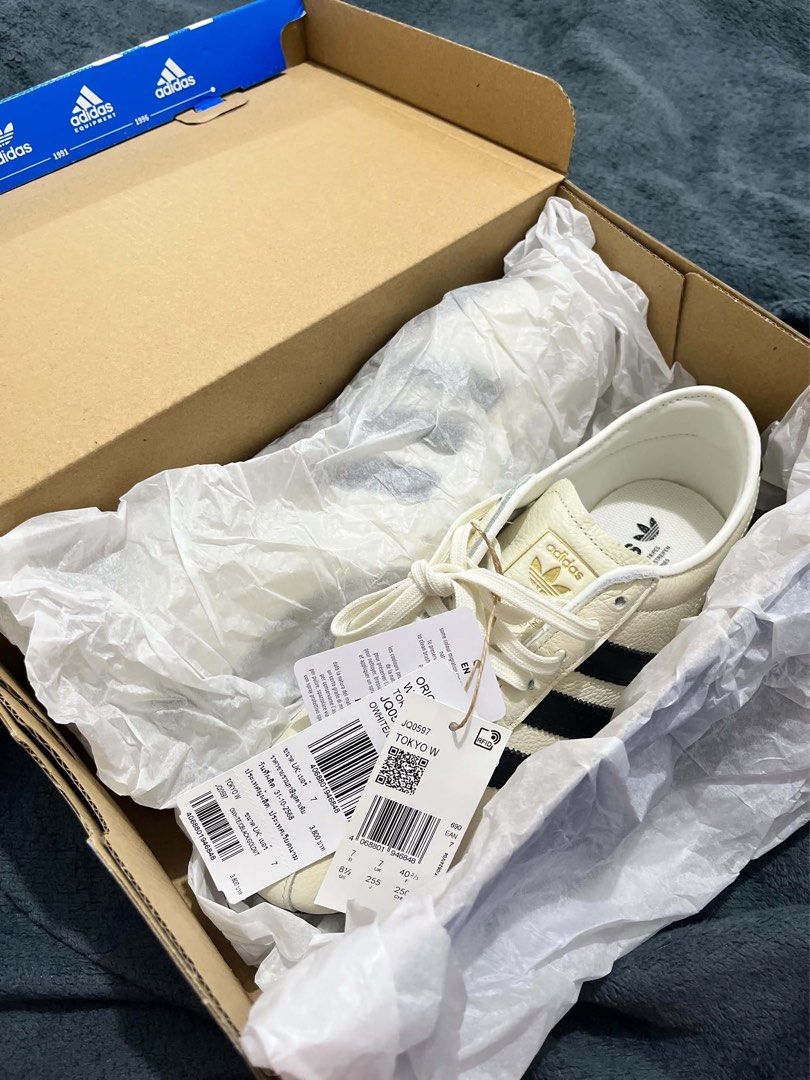 Tokyo Adidas Off White Size US 8.5 (Category: Sneakers) located in Quezon City. Submitted by heatkicks_ph (Listing ID 1468251465, Image 2). Description: - Brand: Adidas - Model: Tokyo W (Style Code: JQ0597) - Colorway: Off White / Black / Gold - Size: Women's US 8.5 / UK 7 / EU 40 2/3 - Condition: Brand new, never worn, with original tags attached to the laces - Design: Classic leather upper featuring iconic black stripes and gold lettering - Pac