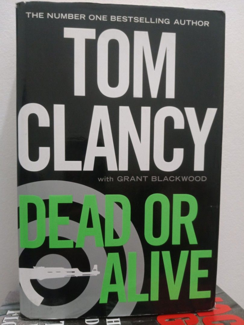 Tom Clancy Dead or Alive Book (Category: Storybooks) located in Bacolor. Submitted by appletun (Listing ID 1468156901, Image 1). Description: - Title: Dead or Alive by Tom Clancy & Grant Blackwood - Format: Hardbound - Condition: Decent, with light shelf wear along the edges - Pages: Complete and fully intact - Genre: Military fiction and suspense.