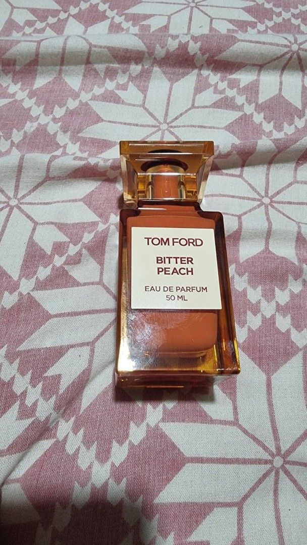 Tom Ford Bitter Peach Eau De Parfum 50ml (Category: Fragrance & Deodorants) located in Urdaneta. Submitted by moxieberrycule (Listing ID 1468135800, Image 2). Description: Tom Ford Bitter Peach EDP perfume 50ml Original and authentic Few sprays missing Not perfect plastic but in good condition bottle Bought for 22,100 Selling for 21,000 (excluding shipping fee) Last 1pc PM for sure, responsible buyer Payment first No return, no refund..