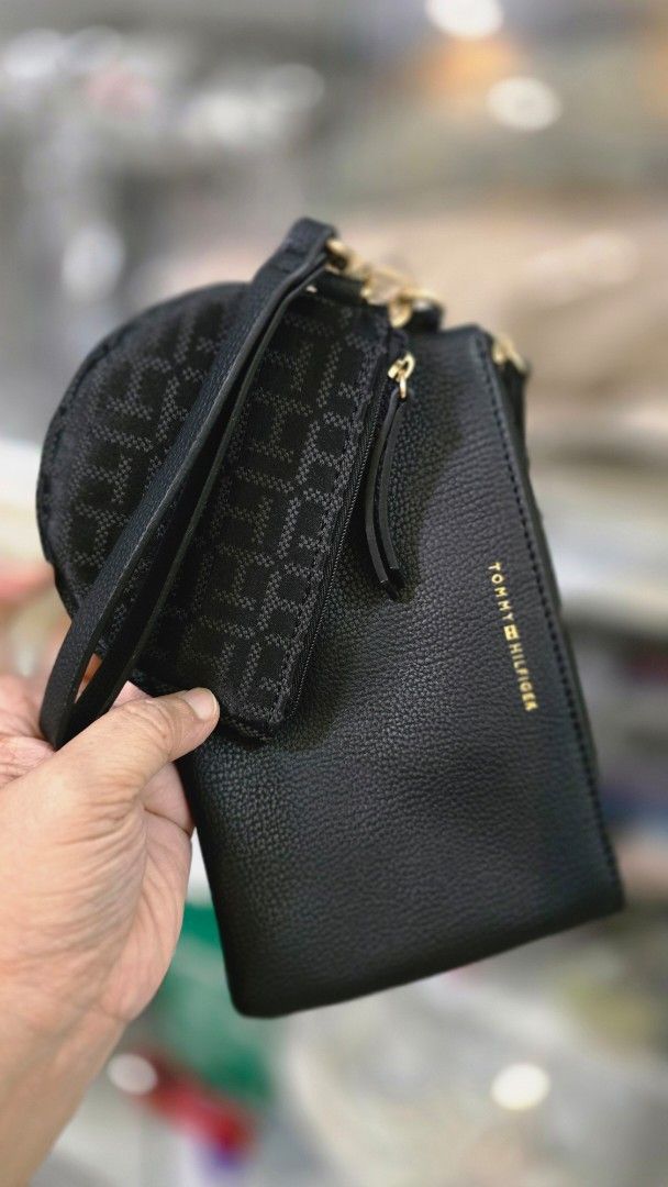 Tommy Hilfiger Black Multi-Pouch Wristlet Set (Category: Purses & Pouches) located in Quezon City. Submitted by momof3_11 (Listing ID 1468074288, Image 3). Description: - Brand: Tommy Hilfiger - Color: Classic Black with Gold-tone hardware - Set includes: Main pebbled pouch and a smaller attached monogram coin purse - Features: Removable wrist strap for versatile styling - Practical layout: Ideal for organizing cards, cash, and small daily essent