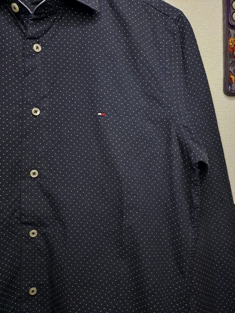 Tommy Hilfiger Micro Pindot Regular Fit (Category: Formal Shirts) located in Quezon City. Submitted by yaseen73 (Listing ID 1468267833, Image 2). Description: Authentic Tommy Hilfiger Dark Blue Patterned Long - Sleeve Casual Shirt Micro Polka - Dot or Pindot Design With Contrasting Collar Lining Wearing Size : Medium - Large Dimensions : Width '21 Length '29 Color Rate : 9.5/10 No Issue In Excellent Condition Needs Re - Wash 🔥🔥🔥 Pre - Owned 🔥