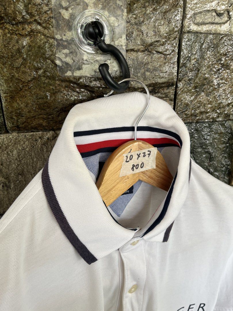 Tommy Hilfiger Script White Poloshirt (Category: Tshirts & Polo Shirts ) located in Cagayan de Oro. Submitted by curatedheirloomph_ (Listing ID 1468226654, Image 3). Description: 𝘿𝙞𝙢𝙚𝙣𝙨𝙞𝙤𝙣𝙨: 20x27 𝘽𝙚𝙨𝙩 𝙁𝙞𝙩: Medium 𝘾𝙤𝙣𝙙𝙞𝙩𝙞𝙤𝙣 & 𝘾𝙤𝙡𝙤𝙧 𝙍𝙖𝙩𝙚: Excellent (9.5/10) 𝙄𝙨𝙨𝙪𝙚: N/A 𝘼𝙪𝙩𝙝𝙚𝙣𝙩𝙞𝙘𝙞𝙩𝙮 𝘿𝙚𝙘𝙡𝙖𝙧𝙖𝙩𝙞𝙤𝙣: Authentic.