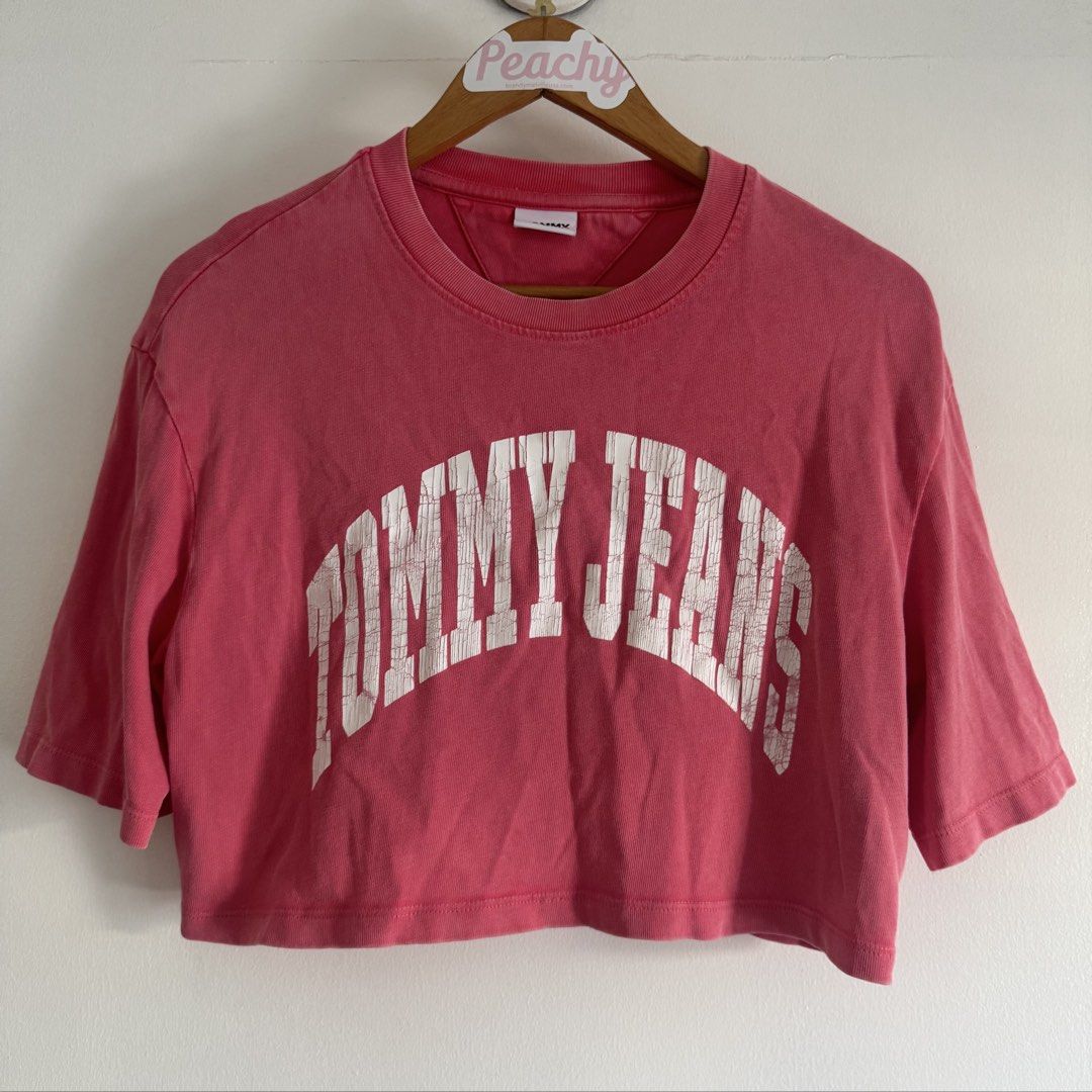 Tommy jeans crop shirt (Category: Shirts) located in Manila. Submitted by apparella.ph (Listing ID 1468135367, Image 1). Description: Selling low Used once Ung crack is design niya and faded pink tlga actual color. Keep ko sana kaso maliit na sakin Bought in Puerto rico pa physically sa store Originally got it for 2k++ 10/10, no flaws Bust:42 Length:17 ☑️Everything is my Own preloved / BNWT/BNWOT ☑️ not thrifted/Ukay ☑️ malukot sa picture kasi na