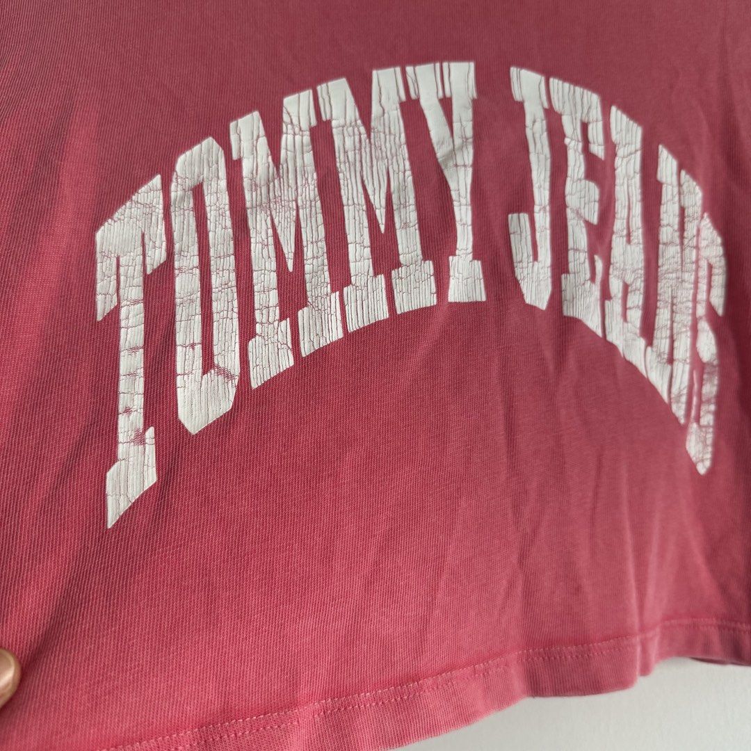 Tommy jeans crop shirt (Category: Shirts) located in Manila. Submitted by apparella.ph (Listing ID 1468135367, Image 3). Description: Selling low Used once Ung crack is design niya and faded pink tlga actual color. Keep ko sana kaso maliit na sakin Bought in Puerto rico pa physically sa store Originally got it for 2k++ 10/10, no flaws Bust:42 Length:17 ☑️Everything is my Own preloved / BNWT/BNWOT ☑️ not thrifted/Ukay ☑️ malukot sa picture kasi na