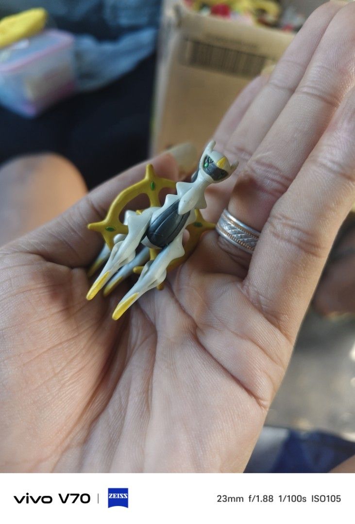 Tomy Arceus Pokemon Figure Mini Toy (Category: Figurines & Statues) located in Kapangan. Submitted by ClumZyDale (Listing ID 1468086292, Image 3). Description: - Item: Tomy Arceus Mini Figure - Design: White and gold with gray detailing - Authentic: Stamped J21 on the back - Condition: Normal signs of previous play and handling - Ideal for: Pokémon fans and toy collectors - Fulfillment: Ready to ship out or meet up.