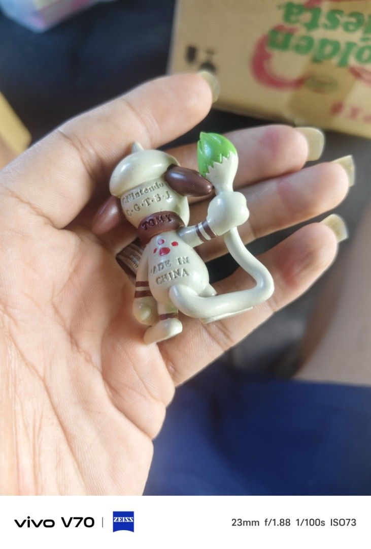 Tomy Smeargle Pokemon Figurine (Category: Figurines & Statues) located in Kapangan. Submitted by ClumZyDale (Listing ID 1468083937, Image 2). Description: - Authentic Tomy Smeargle figure with official Nintendo stamp and 'Made in China' text - Compact size, standing roughly a few centimeters tall - Shows minor scuffs from previous play or storage - Perfect small addition for any Pokémon collector - Ships securely from the Philippines.