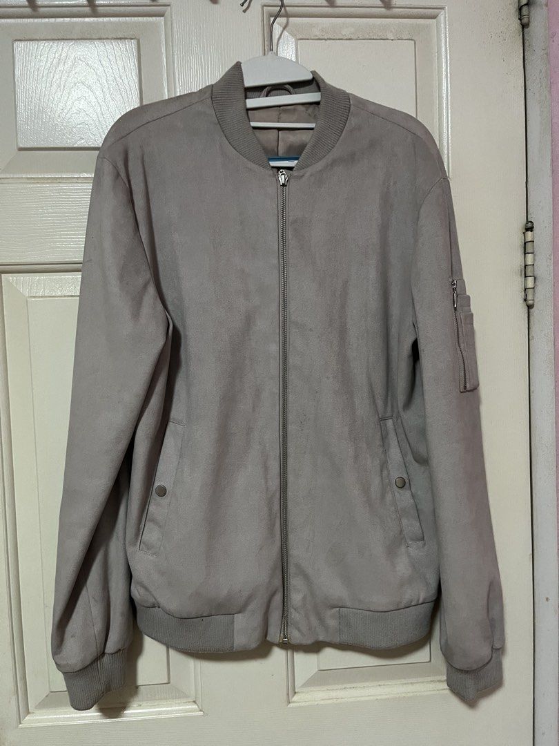 Topman Suede Bomber Jacket Grey UK 40 (Category: Coats, Jackets and Outerwear) located in Cainta. Submitted by dryan0723 (Listing ID 1468077098, Image 1). Description: - Brand: Topman - Style: Bomber jacket - Color: Grey - Material: Faux suede - Size: UK 40 / EUR 101cm / US 40 - Features: Zip front closure, ribbed collar, cuffs, and hem - Pockets: Two front pockets with snap buttons and one zip pocket on the left sleeve.