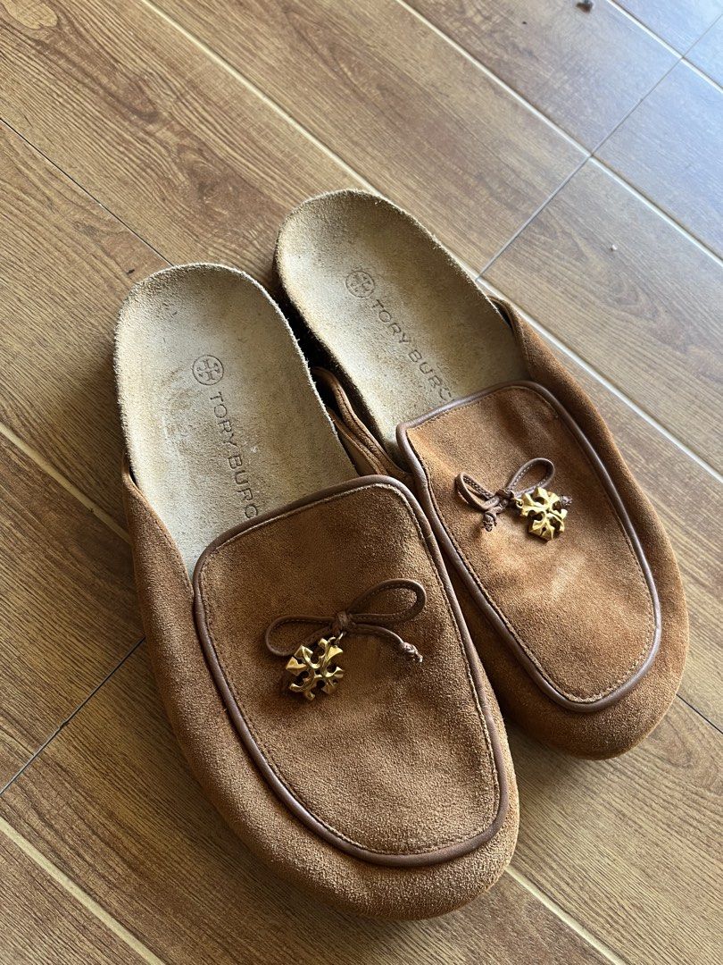 Tory Burch brown suede loafers size 7 (Category: Loafers) located in Manila. Submitted by shanaaa.collects (Listing ID 1468066816, Image 1). Description: - Brand: Tory Burch - Style: Slip-on loafers with cork sole and bow detail with gold hardware - Color/Material: Brown suede - Size: 7 M - Condition: Shows some wear on bottom soles and footbeds, but plenty of life left - Perfect, super comfy style for casual days.