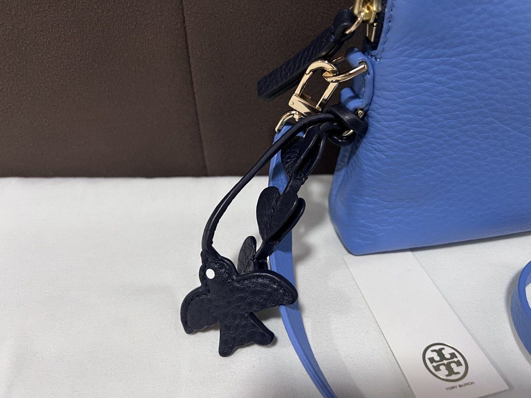 Tory Burch Pebbled bag (Category: Luxury Bags & Wallets) located in Cabanatuan. Submitted by hellorhea (Listing ID 1468216945, Image 2). Description: Pebbled leather texture With heart and bird like pendant on the side With tag seen in the picture .