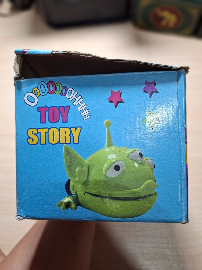 Toy Story Alien Action Figure with Openable Mouth (Category: Figurines & Statues) located in Baguio. Submitted by restyrille77846 (Listing ID 1468091021, Image 1). Description: - Character: Toy Story Green Alien - Design: 3 eyes, blue pants, and interactive head that opens up to show teeth - Inclusions: Comes with original blue box featuring cartoon graphics and Toy Story branding - Condition: Great collectible item for fans and collectors - Loca