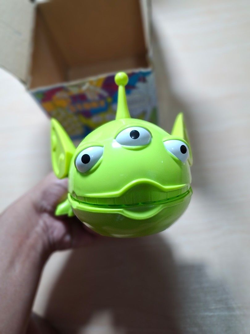 Toy Story Alien Action Figure with Openable Mouth (Category: Figurines & Statues) located in Baguio. Submitted by restyrille77846 (Listing ID 1468091021, Image 2). Description: - Character: Toy Story Green Alien - Design: 3 eyes, blue pants, and interactive head that opens up to show teeth - Inclusions: Comes with original blue box featuring cartoon graphics and Toy Story branding - Condition: Great collectible item for fans and collectors - Loca