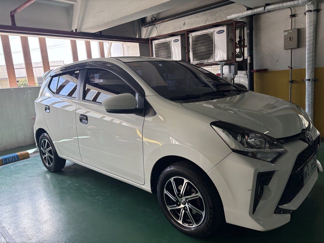 Toyota Wigo (Category: Used Cars) located in Manila. Submitted by jenashara (Listing ID 1468108033, Image 3). Description: Toyota Wigo G 2021 (AT) (Dec 2021 Acquired) Push start Auto folding side mirror Auto AC (digital) Very Low Mileage: 41K Daily driven Lady owned Fresh in and out Back seat still w/ plastic fr casa Keyless Entry (1 key only) Ice Cold Aircon Motolite Battery All LED headlights & foglights Bosch air horn Original spare tire inclu