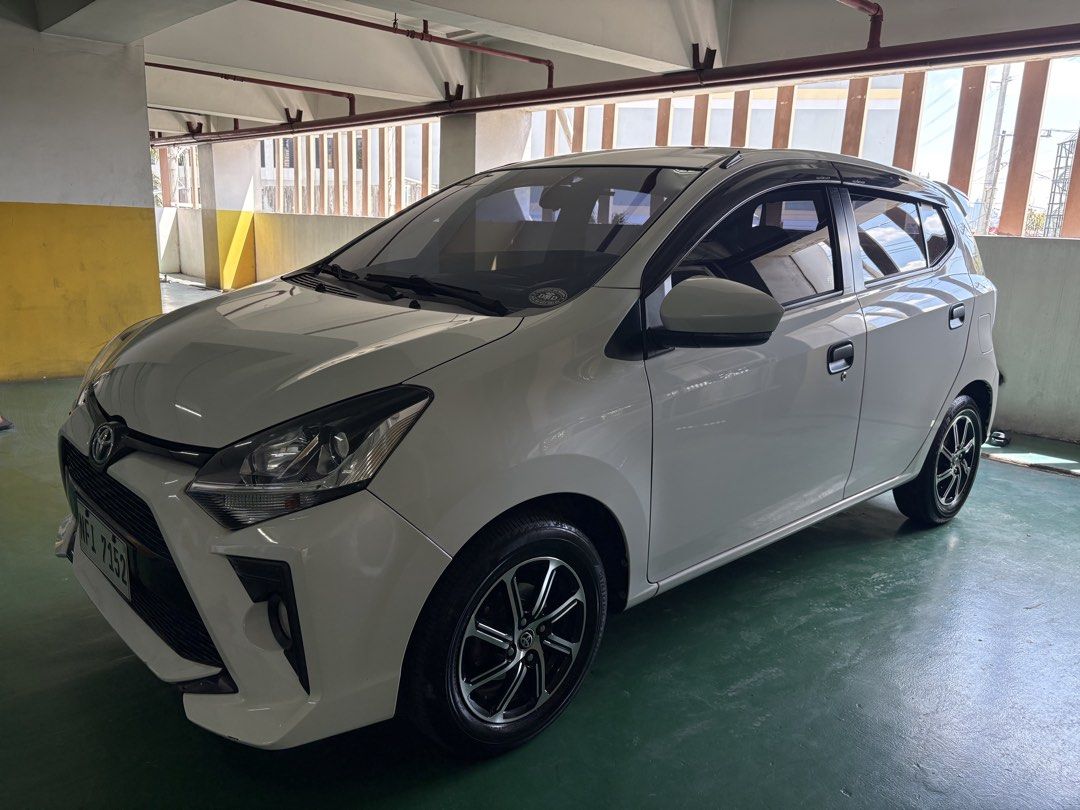 Toyota Wigo (Category: Used Cars) located in Manila. Submitted by jenashara (Listing ID 1468108033, Image 2). Description: Toyota Wigo G 2021 (AT) (Dec 2021 Acquired) Push start Auto folding side mirror Auto AC (digital) Very Low Mileage: 41K Daily driven Lady owned Fresh in and out Back seat still w/ plastic fr casa Keyless Entry (1 key only) Ice Cold Aircon Motolite Battery All LED headlights & foglights Bosch air horn Original spare tire inclu