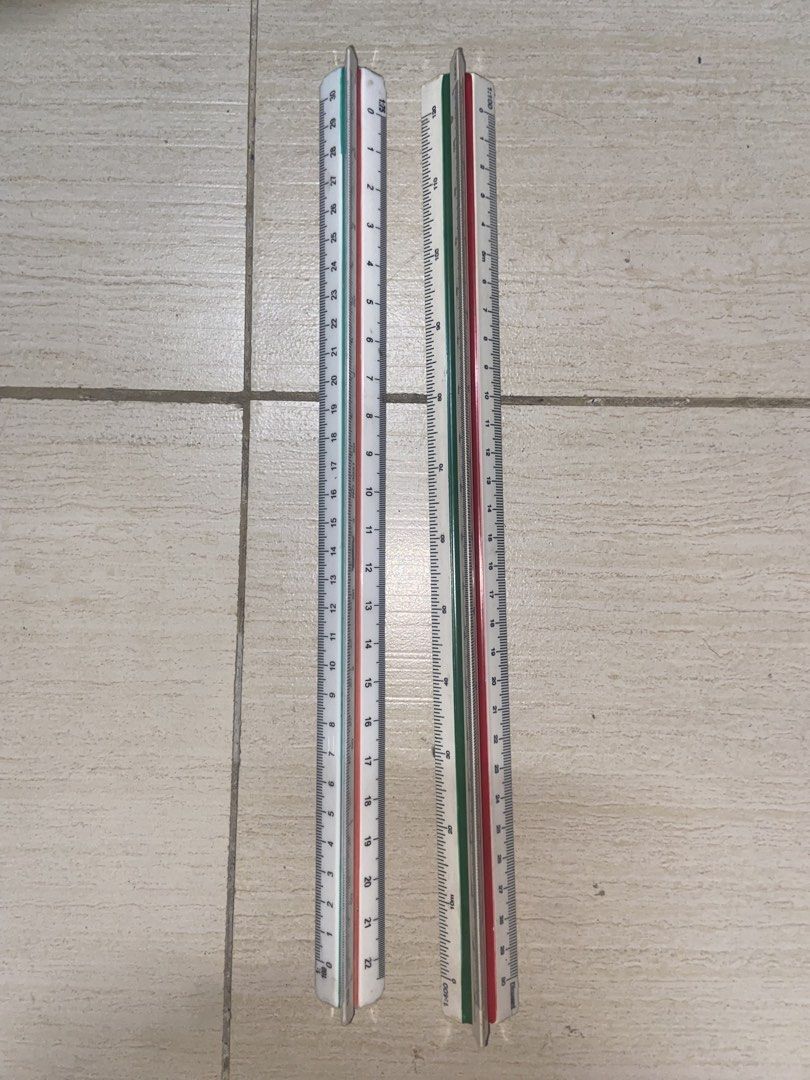 Triangular Architectural Scale Ruler Drafting Tool Set (Category: Stationery & School Supplies) located in Manila. Submitted by jvpd31 (Listing ID 1468086524, Image 1). Description: - Set of 2 durable triangular scale rulers - Made with sturdy metal construction for long-lasting use - Clear printed numbers with red and green measurement ratios on a white body - Ideal tools for students, architects, and designers - Perfect for drafting, blueprints