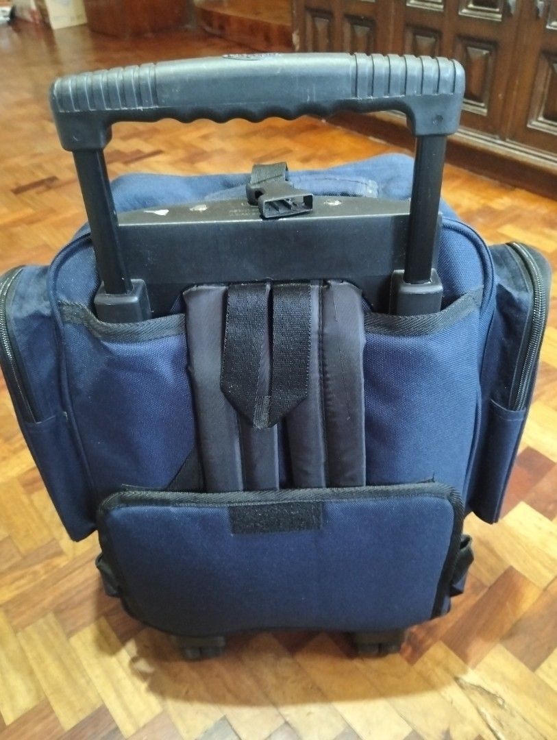 Trolley backpack wheeled by Olympia (Category: Travel Essentials & Accessories) located in Manila. Submitted by bethistama04142 (Listing ID 1468117935, Image 3). Description: - Brand: Olympia Sports Plus - Color: Blue - Condition: Good, well-maintained - Features: Retractable handle with smooth-rolling wheels - Versatility: Convertible design with hidden backpack straps - Storage: Spacious main compartment and multiple zippered outer pockets.