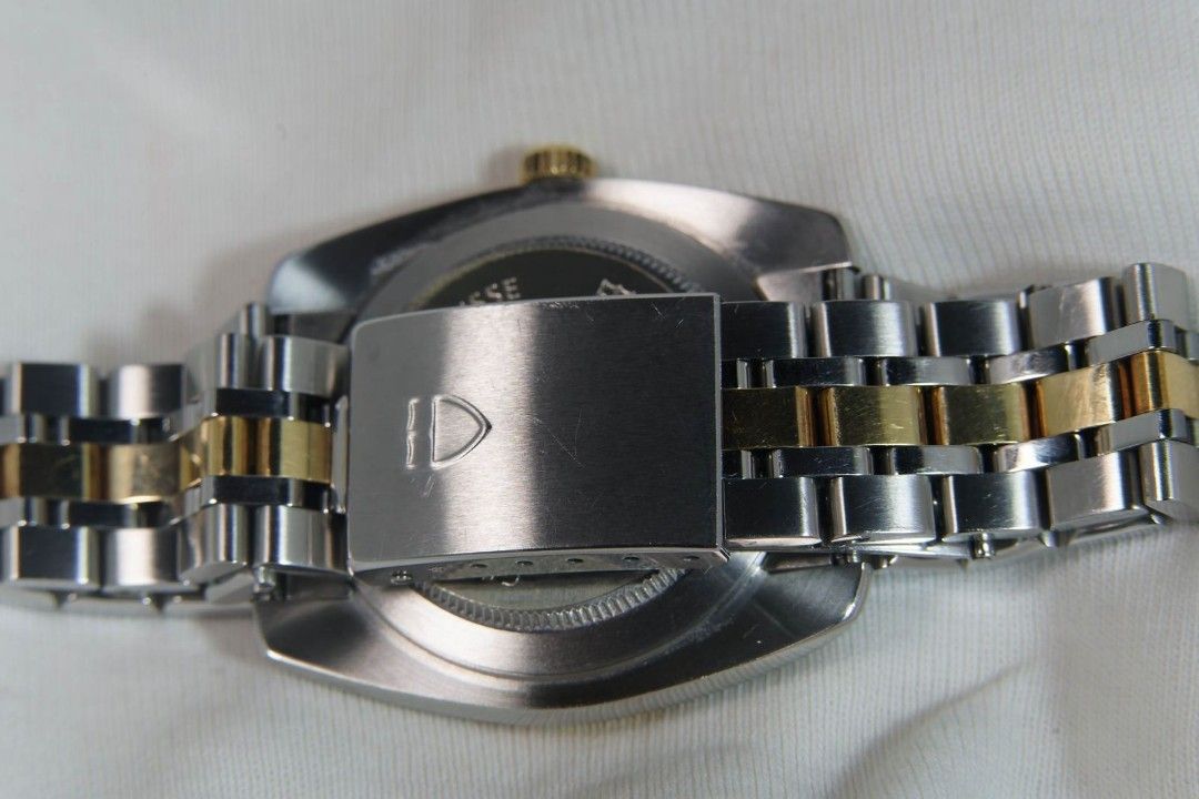 Tudor Classic Date Two-Tone Watch (Category: Luxury Watches) located in Quezon City. Submitted by westlites (Listing ID 1468106937, Image 3). Description: Tudor Classic Date 21013. Automatic 18K yellow gold and steel 38mm case and two-tone bracelet with black dial, 100 meters water resistant. Very clean with back plastic sticker, complete with box and papers and spare links. Authentication at buyer's cost. Asking P120K, please text or call 097728