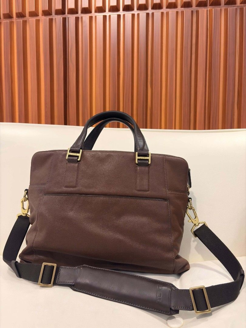 Tumi Dark Brown Leather Slim laptop Briefcase (Category: Luxury Bags & Wallets) located in Manila. Submitted by jzjapansurplus (Listing ID 1468099127, Image 2). Description: IMPORTED FROM JAPAN ORIGINAL TUMI BRAND DARK BROWN LEATHER SLIM BRIEFCASE 🎯 FRONT AND BACK POCKET COMPARTMENT 🎯 TOP HANDLE CARRY 🎯 ELEGANT STYLE SLIM FILE BAG 🎯QUALITY LEATHER MATERIAL 🎯WIDE SPACE CAPACITY 🎯 WITH SHOULDER STRAP 🎯 GUARANTEED AUTHENTIC NO ISSUE..IN VERY 