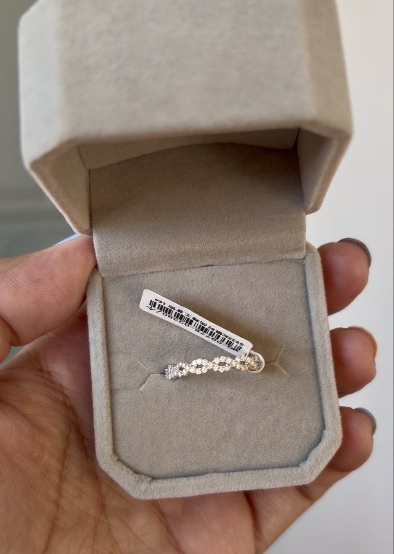 Twist Moissanite eterntiy ring (Category: Rings) located in Rizal. Submitted by katmandulovesmakeup (Listing ID 1468135903, Image 1). Description: Bnew twist moissanite eternity ring Size 6 S925 silver setting .