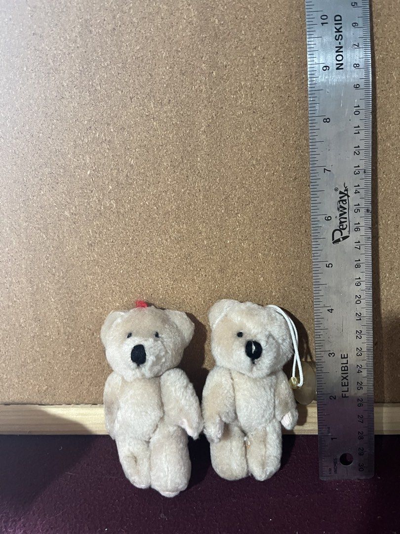 Two Small Cream Colored Teddy Bear Plush Toys (Category: Plushies & Soft Toys) located in Baguio. Submitted by gaara1234 (Listing ID 1468283121, Image 1). Description: - Set of 2 small cream teddy bear plush toys - Compact size: roughly 3 inches tall - Left bear features a cute red ribbon on its head - Right bear comes with a convenient white hanging loop - Features sweet black stitched eyes and noses - Made with soft, huggable fabric.