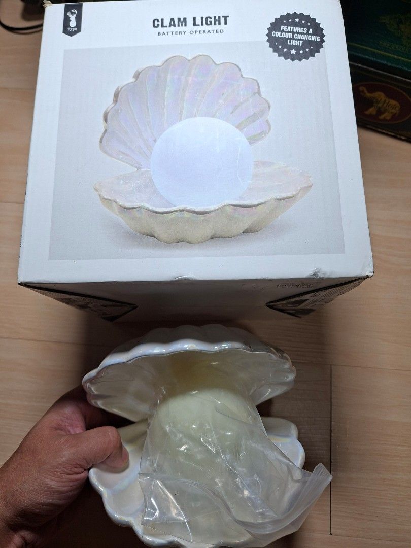 Typo Iridescent Clam Light (Category: Lighting) located in Baguio. Submitted by restyrille77846 (Listing ID 1468091553, Image 2). Description: - Iridescent typo clam light with color-changing pearl - Battery operated (requires 3 x LR44 or AG13 batteries) - Comes with original box and packaging - Perfect glowing decor for desks or bedside tables - Fun and aesthetic gift idea.