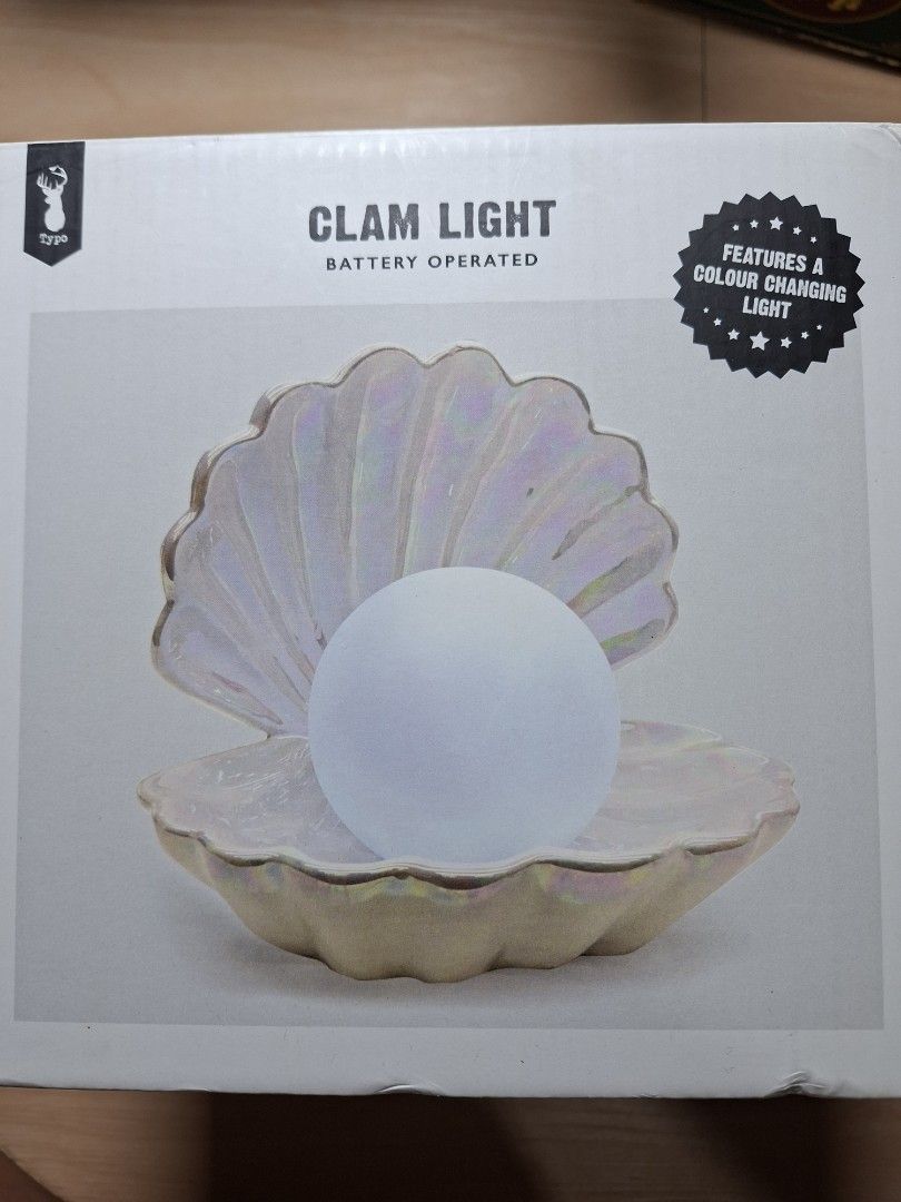 Typo Iridescent Clam Light (Category: Lighting) located in Baguio. Submitted by restyrille77846 (Listing ID 1468091553, Image 1). Description: - Iridescent typo clam light with color-changing pearl - Battery operated (requires 3 x LR44 or AG13 batteries) - Comes with original box and packaging - Perfect glowing decor for desks or bedside tables - Fun and aesthetic gift idea.