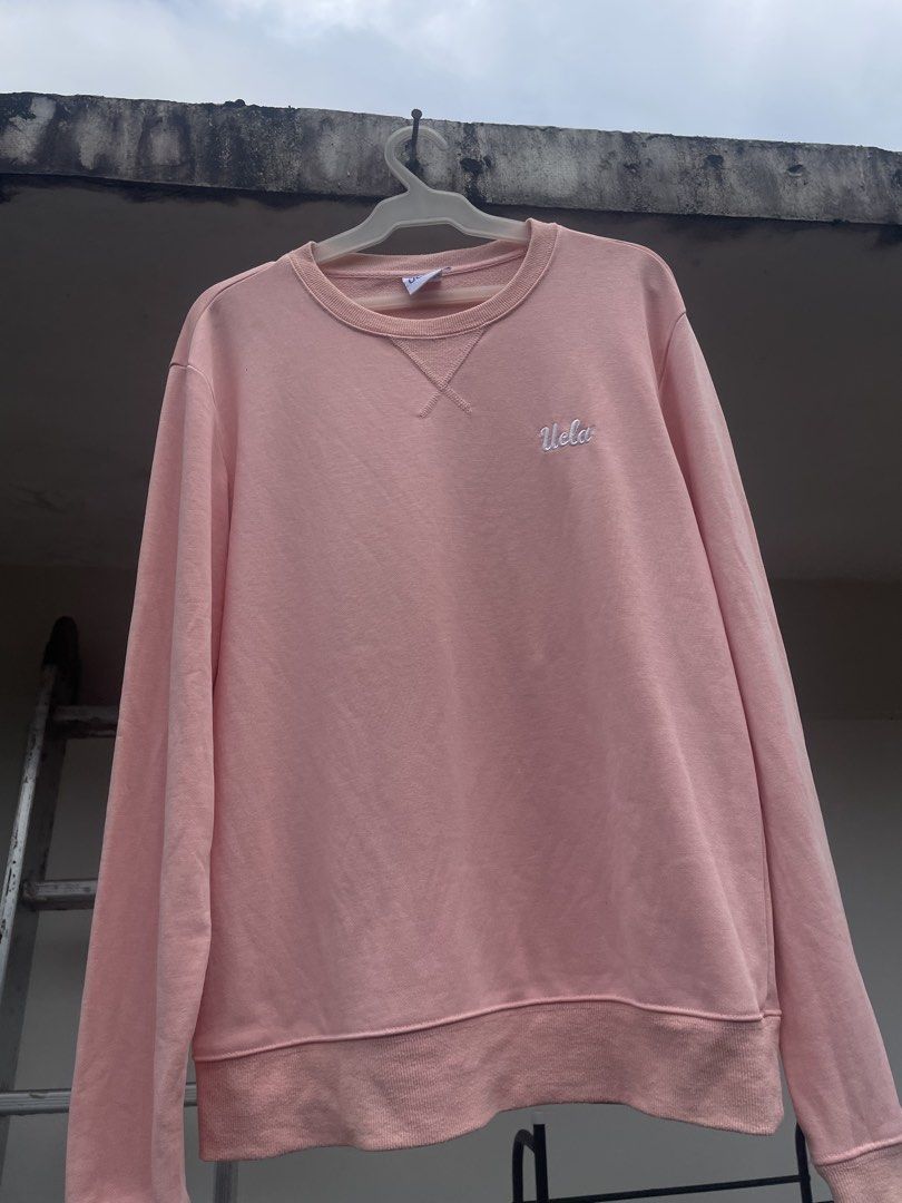 UCLA Pink Crewneck Sweatshirt Size L (Category: Coats, Jackets and Outerwear) located in Manila. Submitted by jssur (Listing ID 1468193458, Image 1). Description: - Authentic UCLA crewneck sweatshirt in a trendy pink shade - Size: L (tag attached at the neckline) - Material: 100% premium cotton for maximum comfort - Design: Features an embroidered script logo on the left chest and V-stitch collar detail - Condition: Brand new with clean interior 