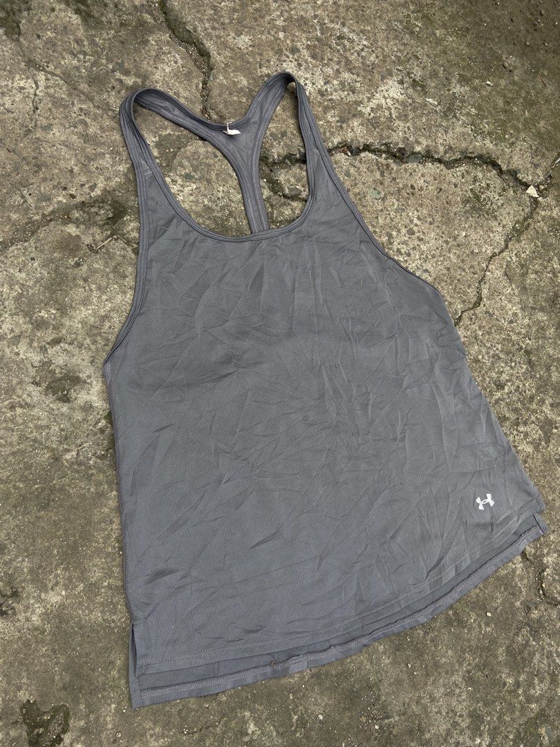 Under Armour gray racerback athletic tank top (Category: Swim Top & Rash Guards) located in Cavite. Submitted by abasolo_jv (Listing ID 1468127620, Image 2). Description: Good Condition 10/10 Color Rate No issue 18-20x26 Dimes .