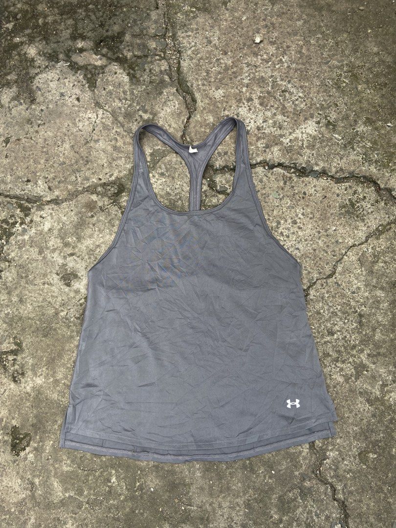Under Armour gray racerback athletic tank top (Category: Swim Top & Rash Guards) located in Cavite. Submitted by abasolo_jv (Listing ID 1468127620, Image 1). Description: Good Condition 10/10 Color Rate No issue 18-20x26 Dimes .