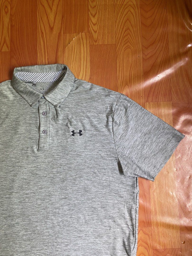 Under Armour polo shirt (Category: Activewear) located in Cebu City. Submitted by jerianix (Listing ID 1468192440, Image 2). Description: Under Armour polo shirt Heatgear Size LARGE W22.5 L28.5 Good condition Issue: minimal crack print on the back(see on last picture) .