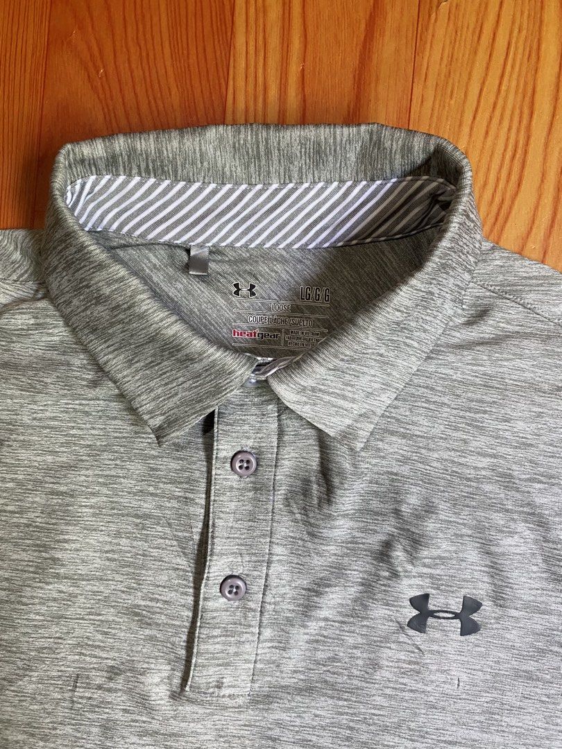 Under Armour polo shirt (Category: Activewear) located in Cebu City. Submitted by jerianix (Listing ID 1468192440, Image 3). Description: Under Armour polo shirt Heatgear Size LARGE W22.5 L28.5 Good condition Issue: minimal crack print on the back(see on last picture) .
