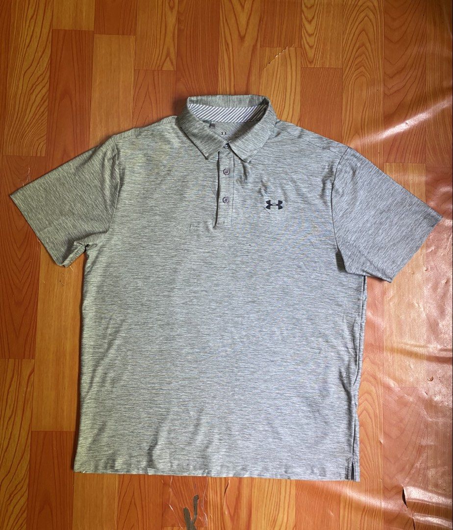 Under Armour polo shirt (Category: Activewear) located in Cebu City. Submitted by jerianix (Listing ID 1468192440, Image 1). Description: Under Armour polo shirt Heatgear Size LARGE W22.5 L28.5 Good condition Issue: minimal crack print on the back(see on last picture) .