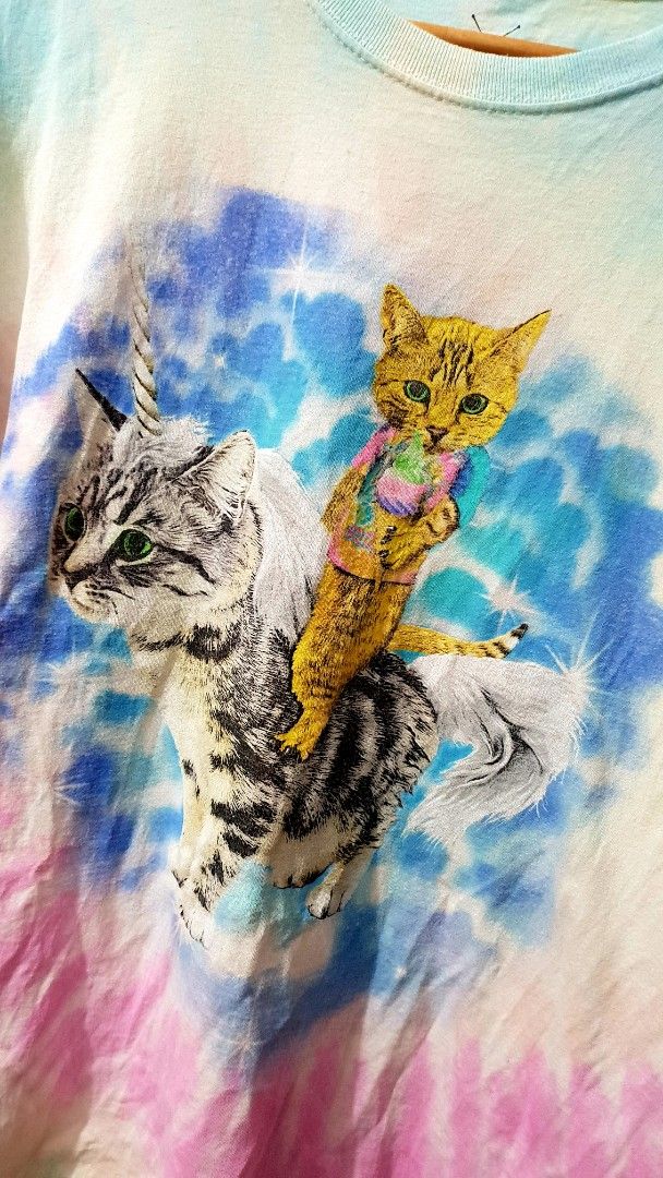 Unicorn Cat Tie Dye (Category: Shirts) located in Taguig. Submitted by wethrifting2021 (Listing ID 1468233400, Image 2). Description: Item: Tie Dye Unicorn Cat & Ice Cream Cat🔥 Size: OPT Social Media (L) Width: 21.5 Length: 27 Condition: Excellent Issue: Hairline SWIPE MORE DETAILS. DM to purchase 📩.