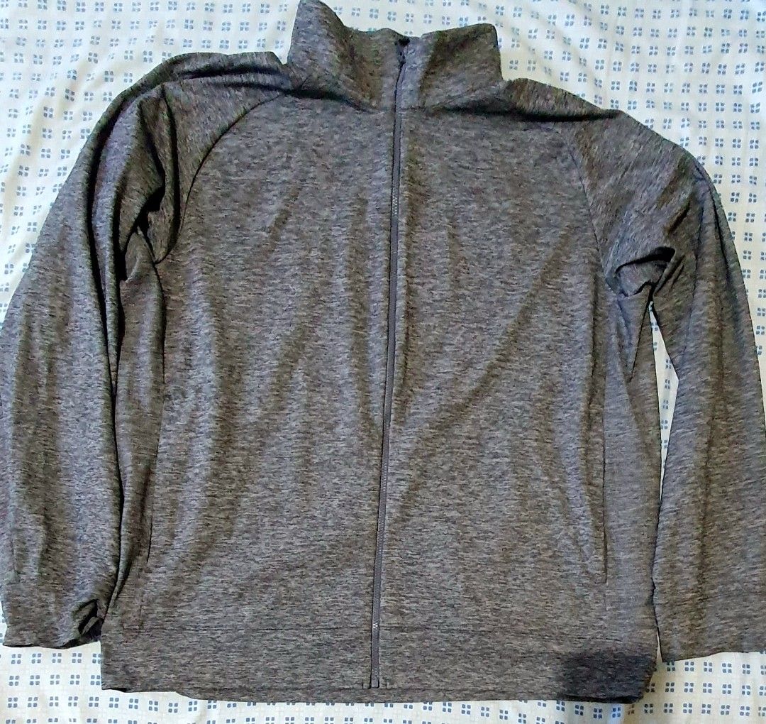 Uniqlo Grey Heathered Full Zip Jacket XL (Category: Coats, Jackets and Outerwear) located in Cainta. Submitted by origeetostore (Listing ID 1458685617, Image 2). Description: - Uniqlo Grey Heathered Full Zip Jacket - Size: XL - Color: Grey Heathered - Features: Stand-up collar, zippered pockets - Material: Comfortable and lightweight - Ideal for: Workouts or casual wear - Origin: Made in Vietnam UNIQLO Track Jacket Color: Gray Size: XL Used but g