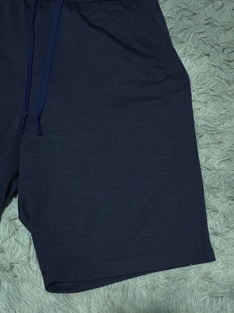 Uniqlo Navy Blue Drawstring Shorts Size L (Category: Shorts) located in Abulug. Submitted by humanwhosellthings (Listing ID 1468181179, Image 2). Description: - Brand: Uniqlo ✅Excellent Condition ✅Issue: none ▫️Waist Size: 30-36 ▫️Length: 20 - Color: Navy Blue - Size: Large - Waistband: Elastic with matching drawstring closure - Pockets: Functional side pockets included - Fabric: Breathable texture - Origin: Made in China - Condition: Great overa