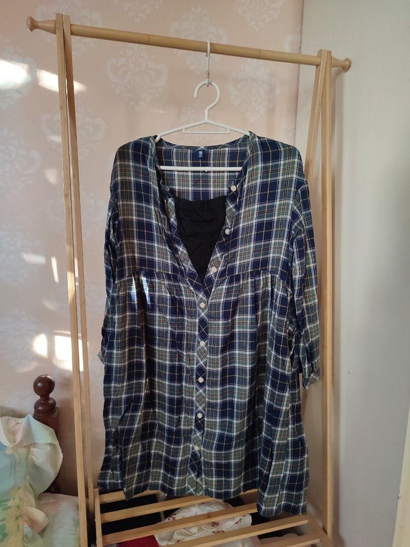 Uniqlo Plaid Dress (Category: Babies & Kids Fashion) located in Jaen. Submitted by roxantiago (Listing ID 1468249236, Image 1). Description: - Brand: Uniqlo - Style: Plaid flannel dress in blue, green, and white - Features: Long sleeves, button-front closure, side pockets, and inner black chest lining - Size: 140 (Kids) - Origin: Made in India - Condition: Great casual everyday piece can remove the black cloth upon request .